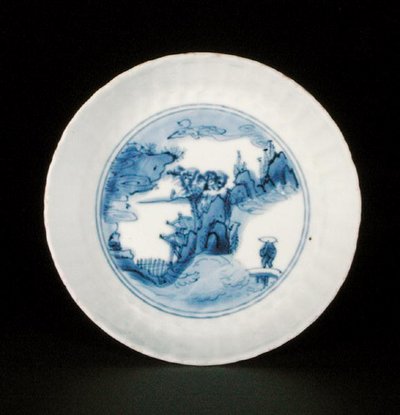 Blue and white kraak saucer dish painted with a figure in a landscape, Egret mark, Wanli or Tianqi by School Chinese