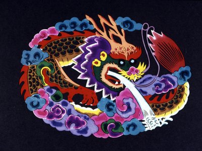 Chinese paper cut and colored with a dragon by School Chinese
