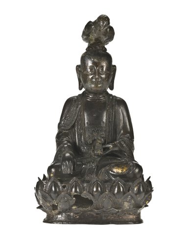 Figure of Guanyin, the Chinese goddess of mercy seated on a lotus design base with a raven perched on her head and a rabbit resting in her left hand by School Chinese