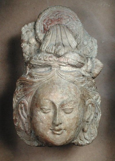 Head of a Bodhisattva with an elaborate hairstyle, from Tumshuq by School Chinese