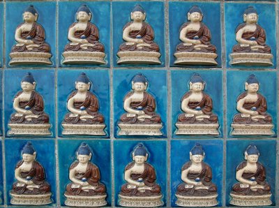 Small Buddhas wall in the island of Hydrangeas (Qionghua) at Beihai Park or North Sea Park in Pekin. Photography, Leonard de Selva, China, 2006 by School Chinese