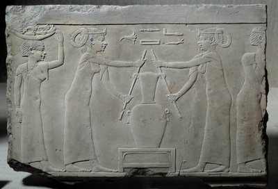 Low limestone relief representing women pressing lily flowers to extract the essence called “lirinon extraction” around 500-400 BC (Egyptian antiquity) by School Egyptian