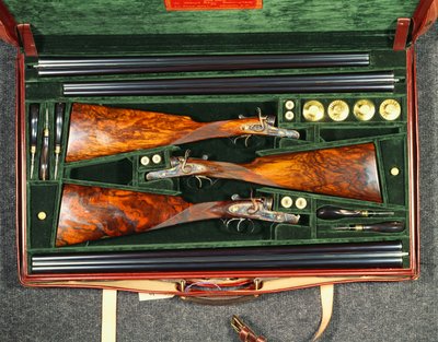A set of three hammer guns by School English
