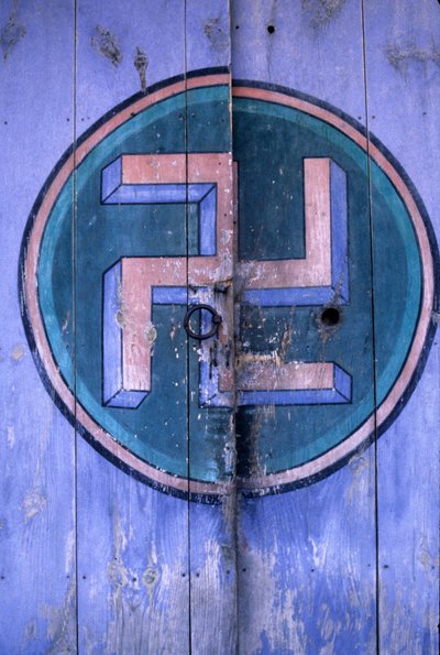 Symbol of Buddhism on one of the gates of the temple 