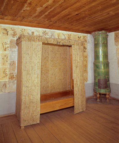 Collapsible bed and ceramic stove in the home of Carl Linnaeus (1707-78) by School Swedish