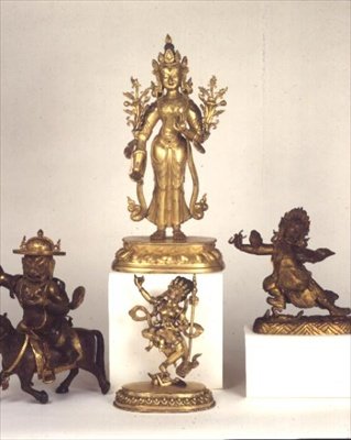 Sino-Tibetan gilt brass figure of Padmapani; East Tibetan gilt bronze figure of Dam-can Dor-je Legs-pa; Sino-Tibetan figure of Syamatara; polychrome figure of Vajravavali by School Tibetan