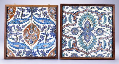 An Iznik tile with plum blossoms and tulips, made circa 1570, and a 17th century Iznik tile with red and blue split palmette by School Turkish