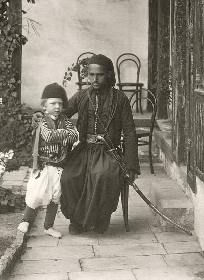 Arab kawass (Ottoman guard) with a young boy in the garden of a house in the Judea District of Jerusalem by Sergeant Henry Phillips