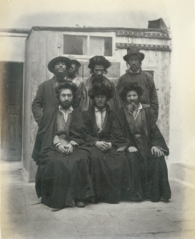 Group of 7 Polish Jews in the Courtyard of the Mediterranean Hotel, Jerusalem by Sergeant Henry Phillips