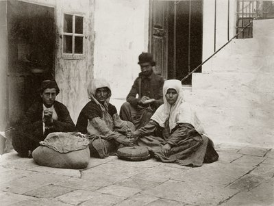 Women grinding flour with round millstones within a courtyard of a house in Jerusalem by Sergeant Henry Phillips