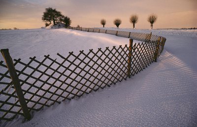 A Viking tomb in the snow near Elverhoej, Denmark in the winter snow by Sisse Brimberg