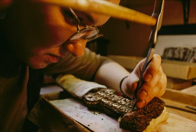 Svetlana Burshneva removes corrosion from a Scythian iron dagger (photo) by Sisse Brimberg
