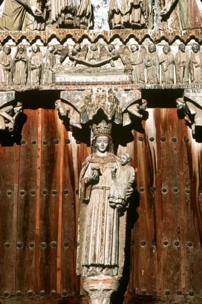 The west portal with statue of Madonna and Child and relief of the Last Judgement by Spanish School