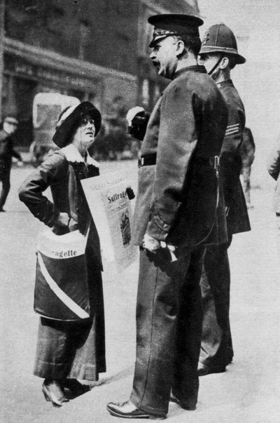 A suffragette confronting two policemen, 1913 by Sport and General