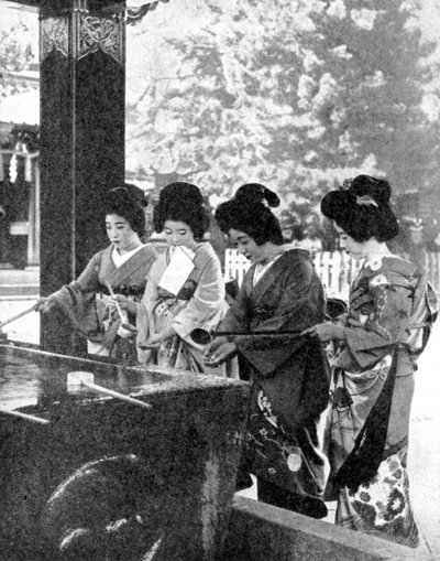 Japanese women washing their hands prior to entering a temple by Sport and General