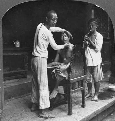 A Chinese Barber at Bhamo, Burma, 1908 by Stereo Travel Co