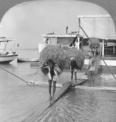 Unloading a Vessel on the Irrawaddy River, Burma, 1908 by Stereo Travel Co