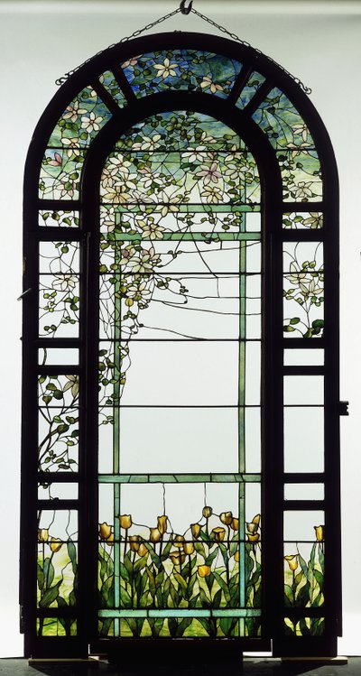 A leaded glass trellised window depicting clematis vines, early 20th century by Studios Tiffany