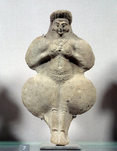 Terracotta statuette of woman holding her breasts, probable representation of Ishtar, goddess of fertility. From Susa. Iran. Elamite period. 14th-12th century BC. Louvre Museum by Sumerian Sumerian