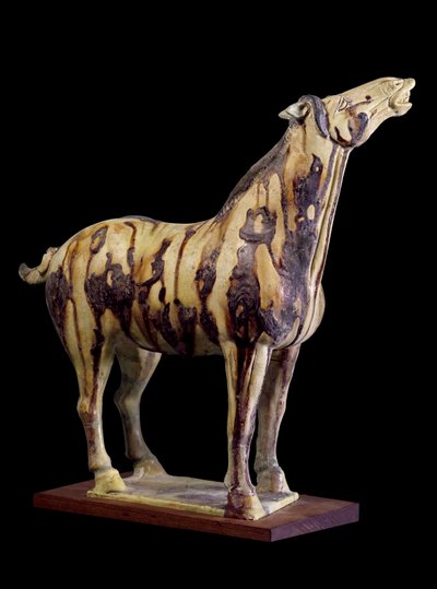 Chinese art: terracotta funerary statuette with tricoloured glazes depicting a henning horse, from the tomb of Princess Yong Tai, Tang Dynasty by Tang Dynasty Chinese School