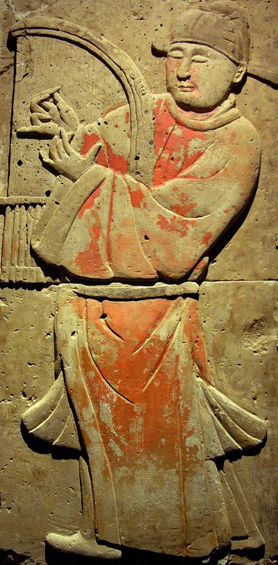 Terracotta stele with musician, Tang Dynasty (618-907), discovered in Shaanxi Province, Steles Forest Museum in Xian. Photography, Leonard de Selva, China, 2006. by Tang Dynasty Chinese School