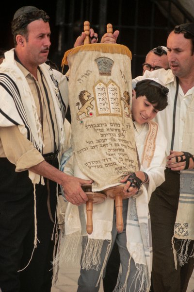Bar Mitzvah boy carries Torah at Bar Mitzvah by Ted Spiegel