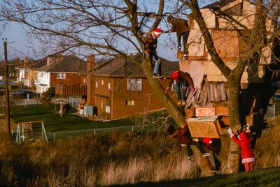 Children in an elaborate treehouse, Kansas City by Ted Spiegel