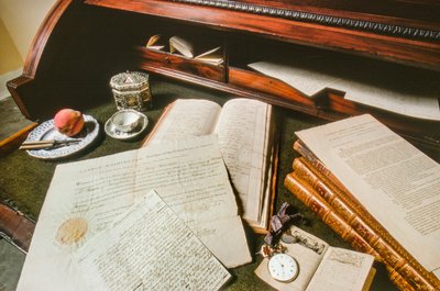 Documents, a watch, and other effects of George Washington are displayed on a desk by Ted Spiegel