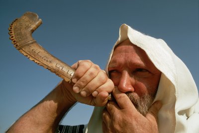 Man Blowing Shofar on Yom Kippur by Ted Spiegel