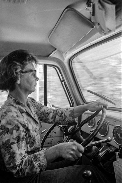 Mildred Cooper, a 43-year-old grandmother, is a truck driver with a logging truck by Ted Spiegel