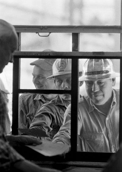Miners getting paychecks at Morenci mine for Phelps Dodge Smelter Douglas Arizona by Ted Spiegel