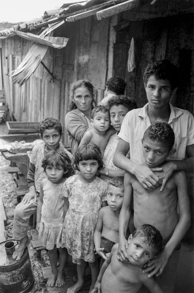 Mother with Ten Children Outside Their Shanty in Mexico by Ted Spiegel