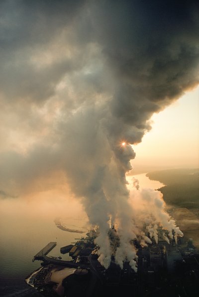 The pulp mill of MacMillan Bloedel Ltd. belches smoke into the sky by Ted Spiegel