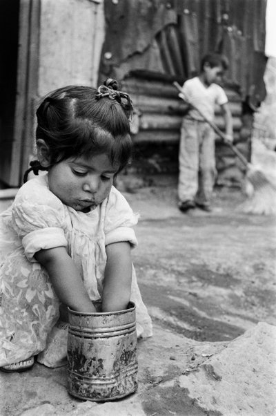 Two Young Children Outside Their Shanty in Mexico by Ted Spiegel