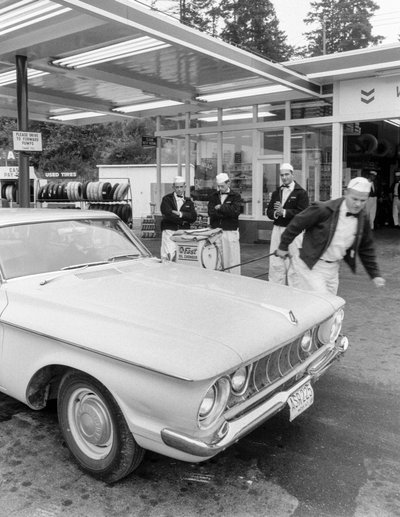 Young men training to be gas station attendants at Chevron station by Ted Spiegel