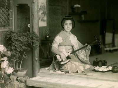 Portrait of a Japanese Woman Playing the Shamisen, circa 1900 - 1915 by Teijiro Takagi