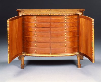 One of a pair of George III commodes by Thomas Chippendale