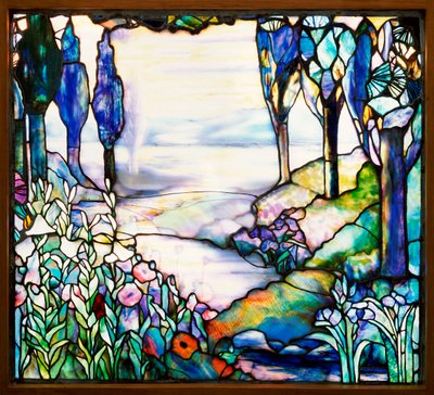 Landscape window depicting a river meandering from a distant mountain range at dusk, with cypress, lilies, poppies and irises, c.1915 by Tiffany and Company