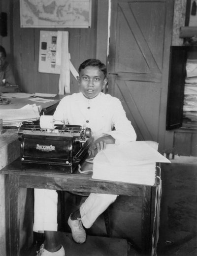 A Young Man Sitting at a Typewriter, Indonesia by Unbekannt