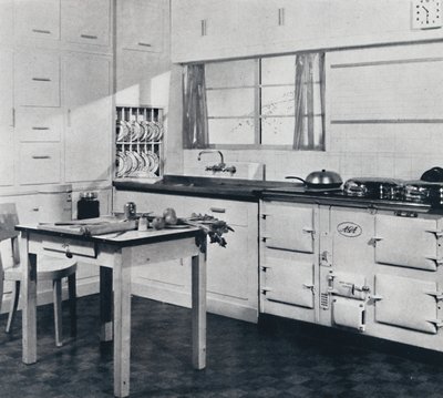 Aga Heat Ltd. The Model F Aga Cooker for a large house finished in black and cream vitreous enamel by Unbekannt