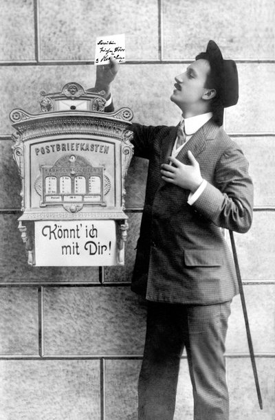 An Elegant Man Posting a Note in a Mailbox, Germany around 1920 by Unbekannt