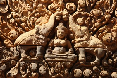 Banteay Srei Temple at Angkor in Cambodia. Lakshmi, Hindu goddess of wealth and wife of god Vishnu, is sprinkled with holy water by two elephants by Unbekannt