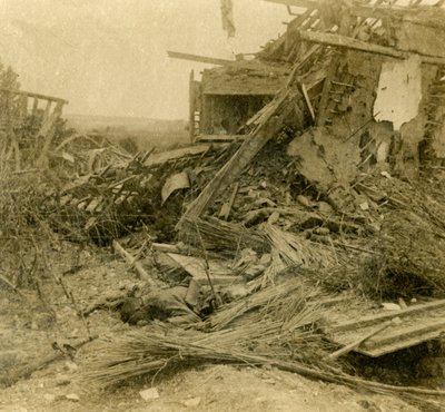 Bombed out building, body of dead soldier in foreground by Unbekannt