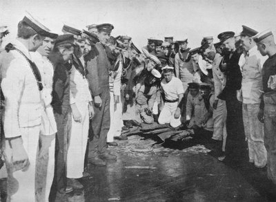 British sailors round a hole in the deck of their vessel by Unbekannt