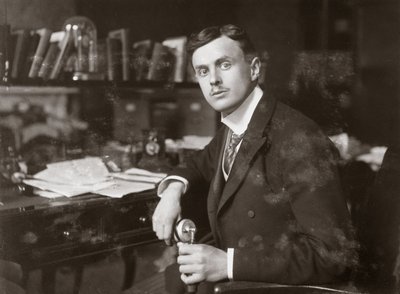 C S Rolls sitting at his desk by Unbekannt