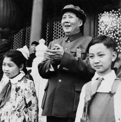 Chairman Mao Zedong applauding paraders from the rostrum at Tien An Men in Beijing, China by Unbekannt