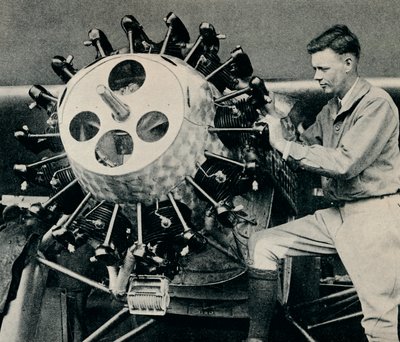 Charles Lindbergh checking the engine of his aircraft before his transatlantic flight by Unbekannt
