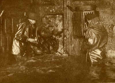 Divers Plugging A Leak During Salvage Operations Waist-Deep In Water On the Lower Decks Of The Germ by Unbekannt