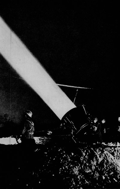 Elephants child. A searchlight of 210,000,000 candle-power probes the night sky with its beam by Unbekannt