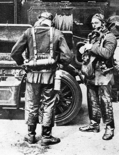 Firefighters donning smoke helmets, Farringdon Street rubber works, London by Unbekannt